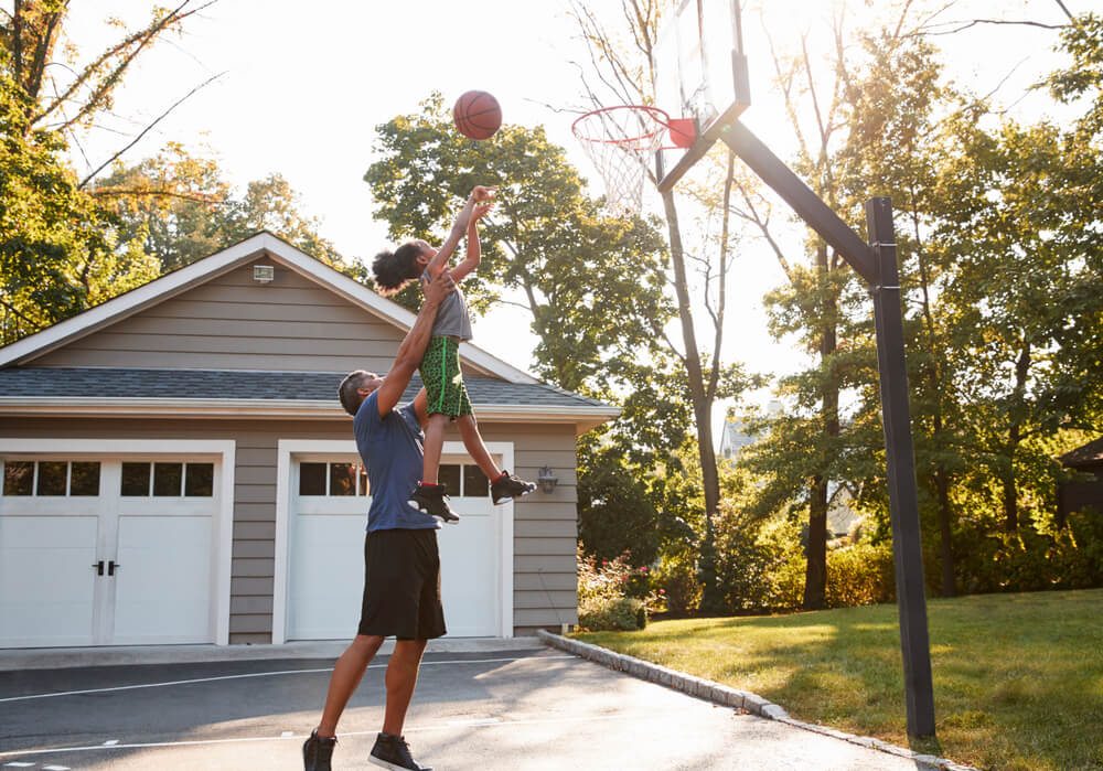 Father and child playing basketball 