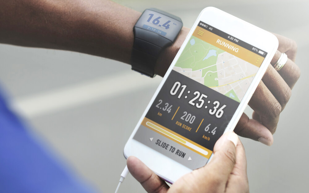Checking watch and mobile phone app for workout statistics 