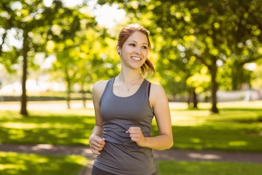 Woman jogging in a park. 