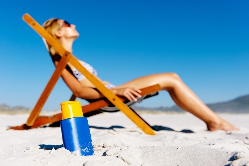 Woman sunbathing in a beach