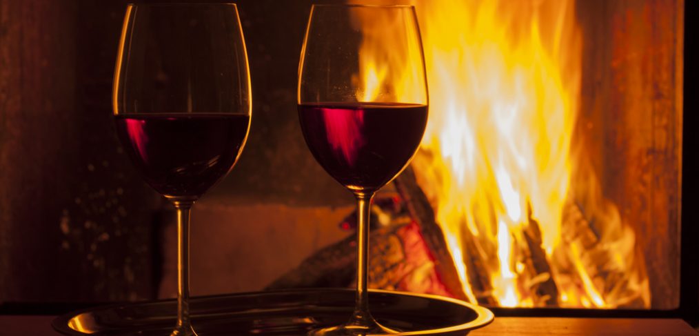 Red wine by the fireplace.