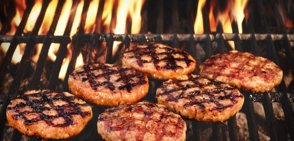 Grilled Burgers Patties On The Hot Flaming Charcoal Grill