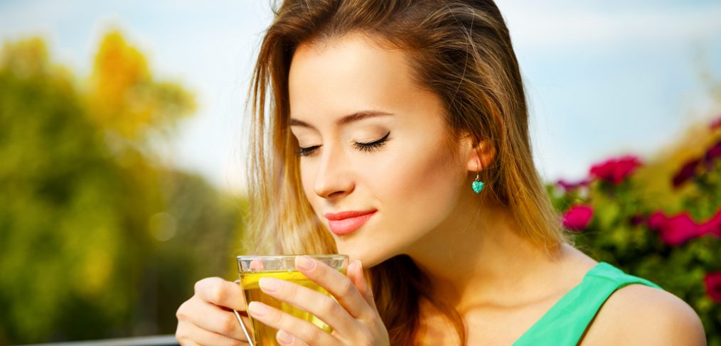 Woman drinking green tea