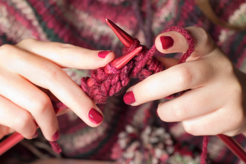 knitting red jumper