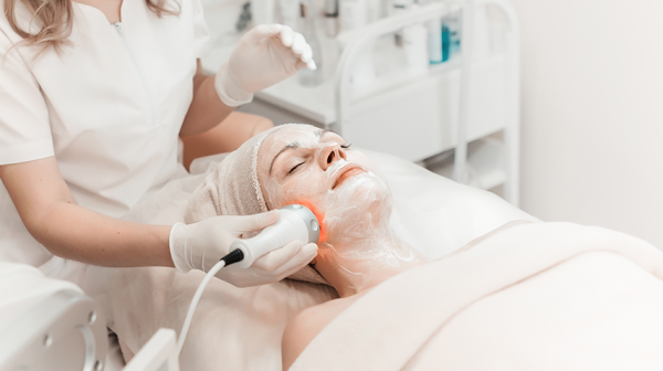 Woman enjoying facial treatment