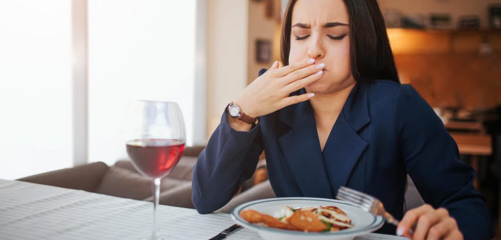 Woman feels sick while eating lunch